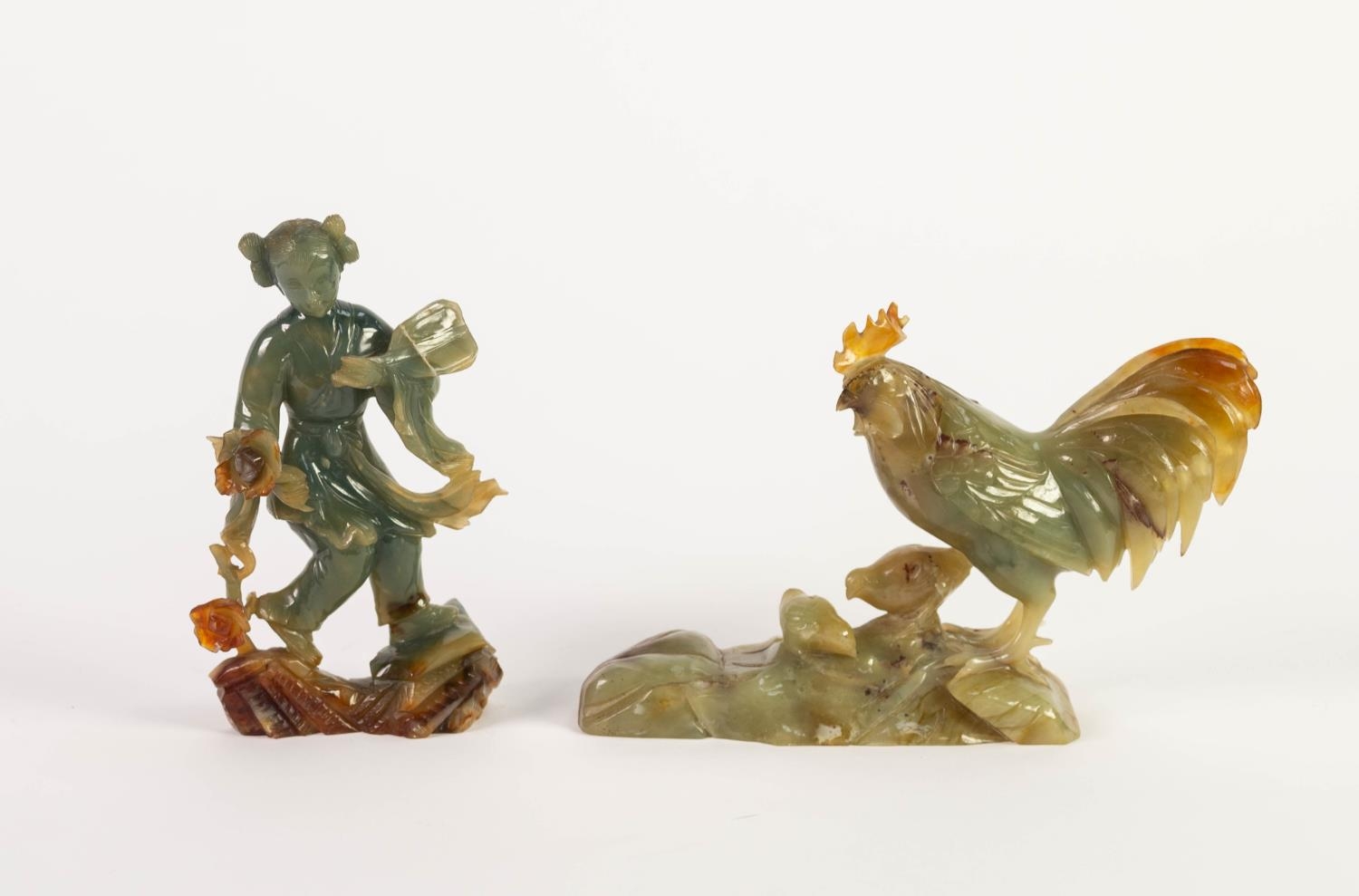TWO CHINESE CARVED GREEN HARDSTONE FIGURES, one modelled as a geisha, holding an open fan and