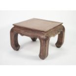 ORIENTAL LIMED HARDWOOD URN STAND, the square top above a shaped and moulded frieze, and raised on