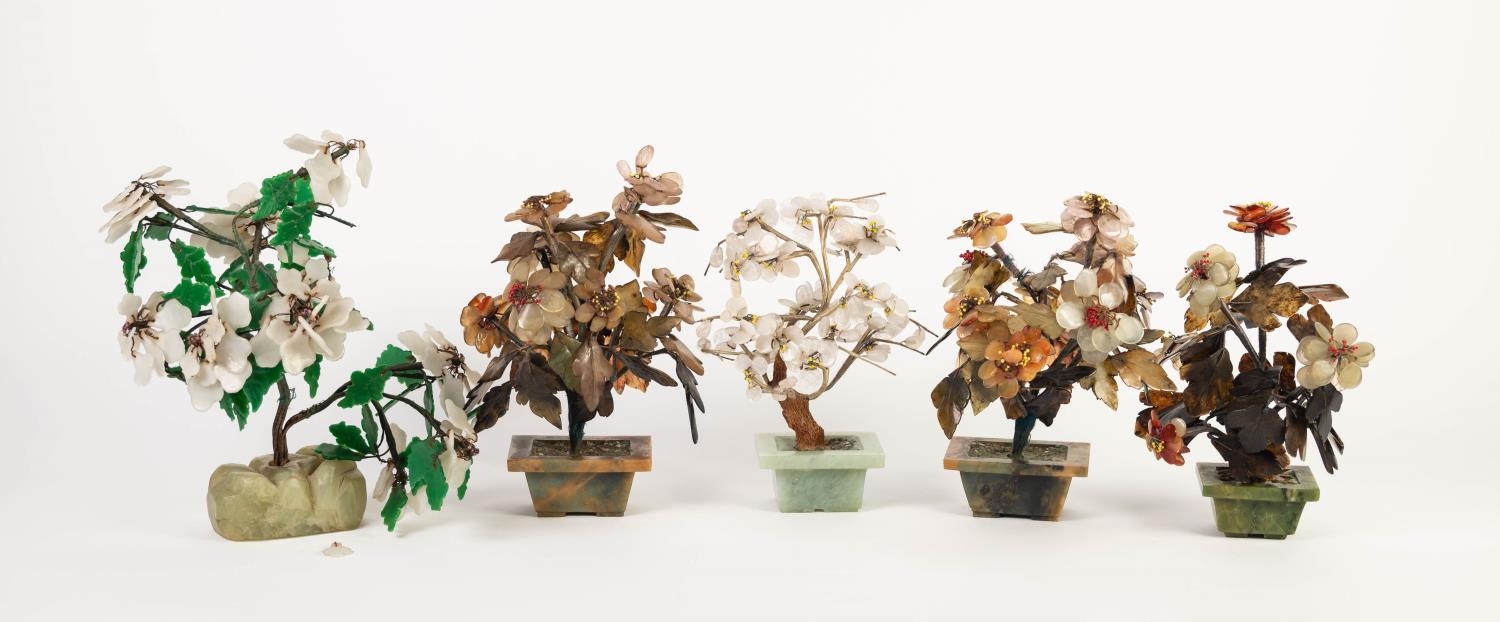FIVE CHINESE CARVED HARDSTONE SMALL MODELS OF BONSAI TREES, including a PAIR IN BROWN VEINED