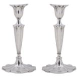 A pair of George V silver candlesticks