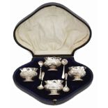 A late Victorian cased set of four silver salts