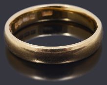 A 22ct gold court shaped wedding band