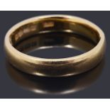 A 22ct gold court shaped wedding band
