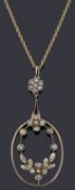 An Edwardian half pearl pendant and chain,