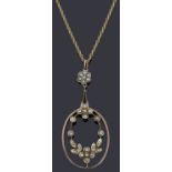 An Edwardian half pearl pendant and chain,