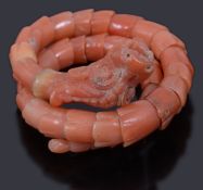 A 19th Century Chinese articulated coral dragon ring