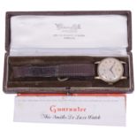 A gentleman's 9ct gold Smiths mechanical strap watch