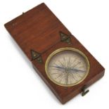 An early 19th century mahogany cased pocket compass