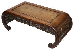 A late 19th century Chinese carved hardwood opium table