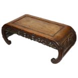 A late 19th century Chinese carved hardwood opium table