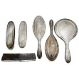 A George V silver six piece dressing table set