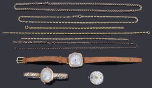 A collection of gold chains and watches