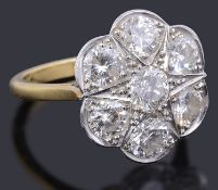 A gold diamond daisy cluster ring
