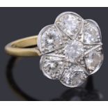 A gold diamond daisy cluster ring