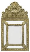 A 19th century Flemish embossed brass cushion wall mirror in 17th century style