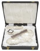 A modern four piece silver backed dressing table set