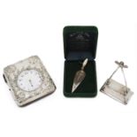 A late Victorian embossed silver and leather travel watch case; others