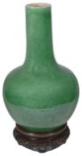 A large late 19th/early 20th century Chinese apple green crackle glazed bottle vase