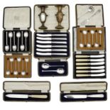 A collection of early 20th century cased sets to include silver coffee spoons