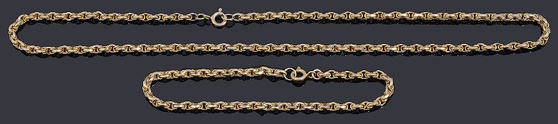 A 9ct gold fancy link facetted chain necklace and matching bracelet