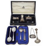 A small collection of silver to include a cased Garrard three piece cruet set