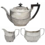 A George V silver three piece tea service