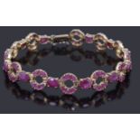 A gold ruby set line bracelet