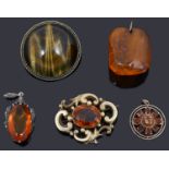 Five brooches and pendants