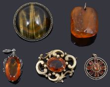 Five brooches and pendants