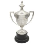 A George V silver twin handled trophy cup and cover