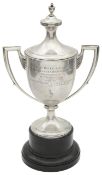 A George V silver twin handled trophy cup and cover