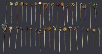 A collection of Victorian and later gold and silver stick pins