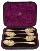 A cased matched set of four silver-gilt George III Old English Pattern 'berry' tablespoons