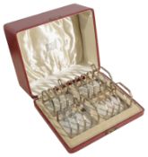 A cased set of four George VI Art Deco silver four division toast racks