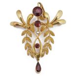 An Edwardian gold garnet and seed pearl open pendant