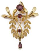 An Edwardian gold garnet and seed pearl open pendant