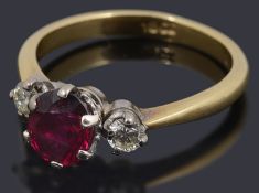 A ruby and diamond three stone ring