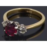 A ruby and diamond three stone ring