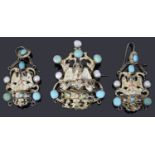 An early 20th century Austro-Hungarian silver gilt gem set pendant and earrings suite