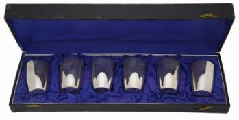 A cased set of six George V silver small beakers or tots