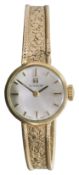 A 9ct gold ladies Tissot mechanical bracelet watch