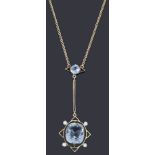 An Art Deco aquamarine and seed pearl pendant on chain