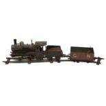 A Carette & Cie Gauge 2 'Storkleg' Live Steam 2-2-0 tinplate locomotive and tender c.1910