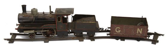 A Carette & Cie Gauge 2 'Storkleg' Live Steam 2-2-0 tinplate locomotive and tender c.1910