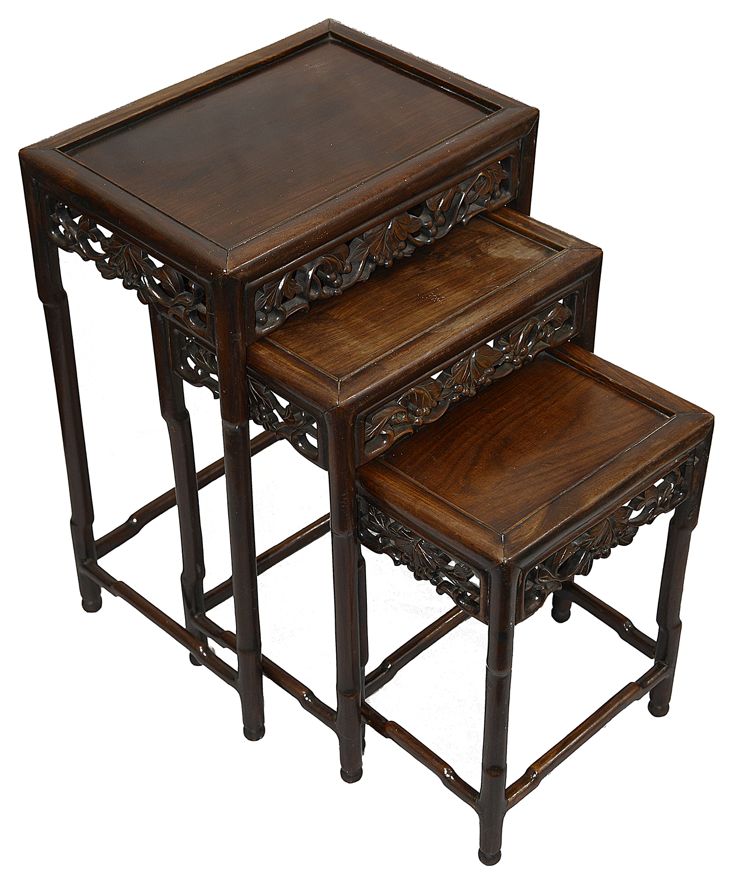 A late 19th century Chinese hardwood nest of three occasional tables