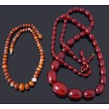 A single row graduated olive shaped cherry coloured bakelite bead necklace