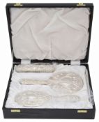 A contemporary silver backed four piece dressing table set in a fitted case