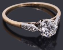 A gold single stone diamond ring