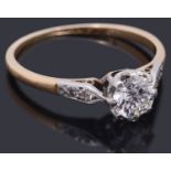 A gold single stone diamond ring