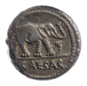 Julius Caesar Silver Denarius49-44 BCElephant advancing right, trampling horned serpent; CAESAR in